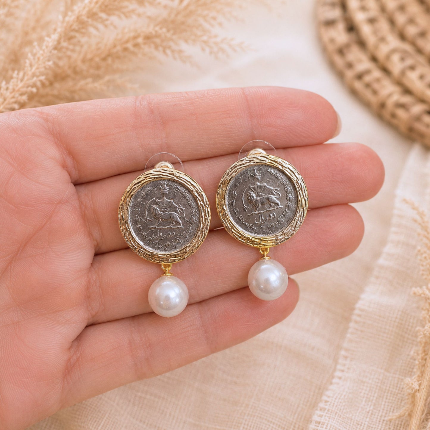 Close up picture of a Phahlavi Coin Vitage Earring with faux pearl drops