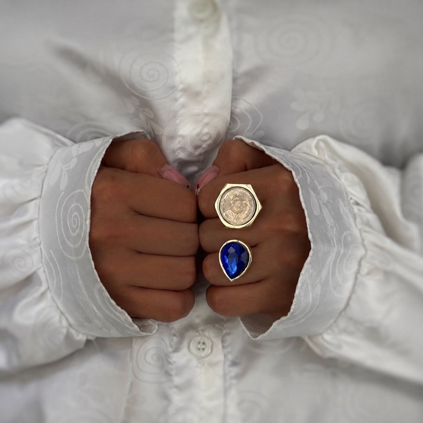 Vintage-inspired adjustable fashion ring with a sapphire blue teardrop crystal and coin detail styled for an elegant everyday look