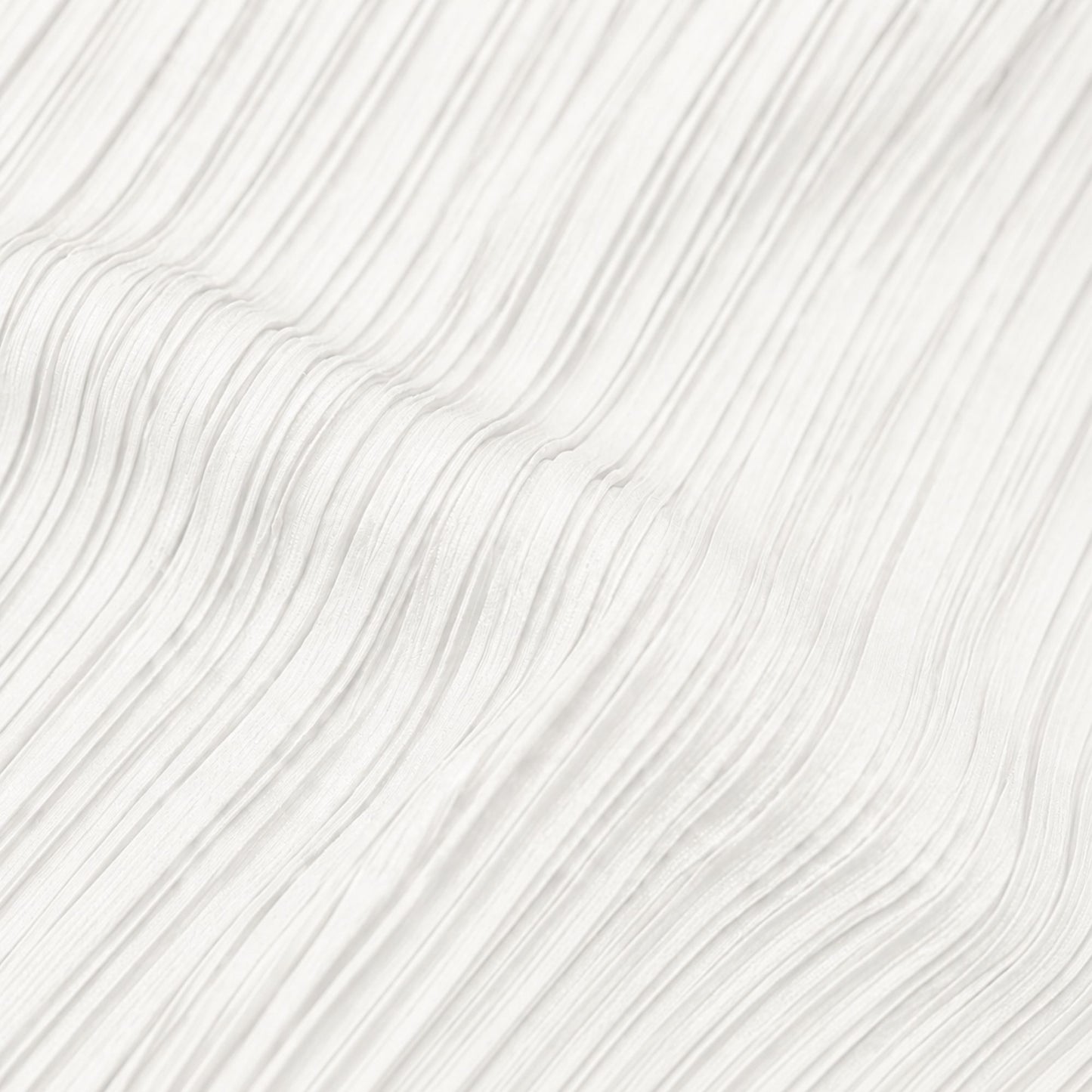 Close-up view of white pleated polyester fabric showing the textured lightweight material and fine pleat detail.