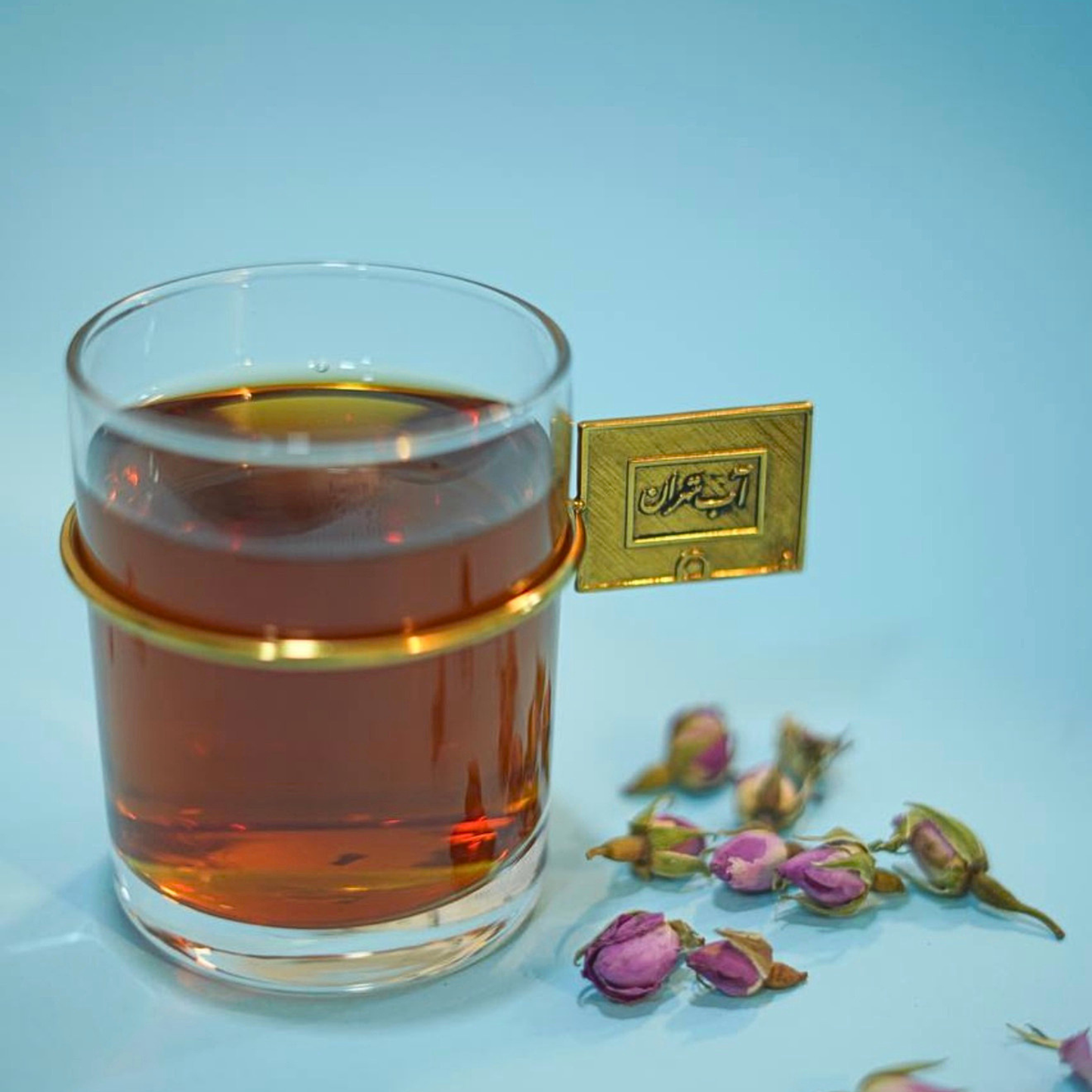 Abeh Tehran inspired clear tea glass with artistic gold handle