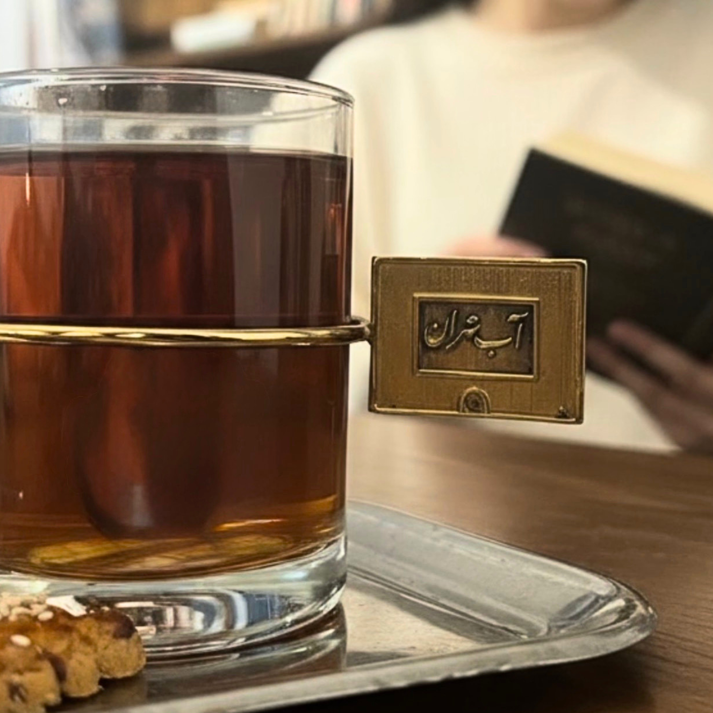 Clear glass tea cup with gold handle Abeh Tehran artistic design