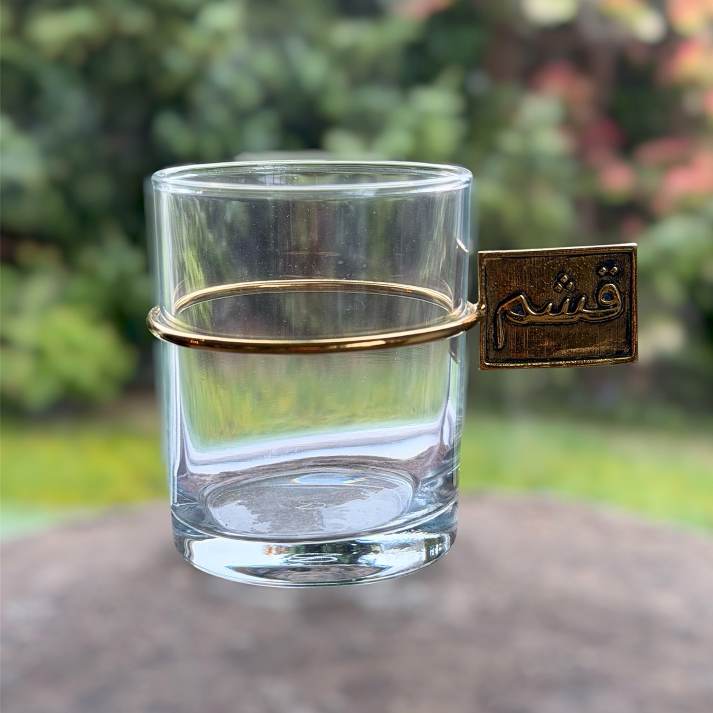 gheshm gold handle glass cup close-up detail
