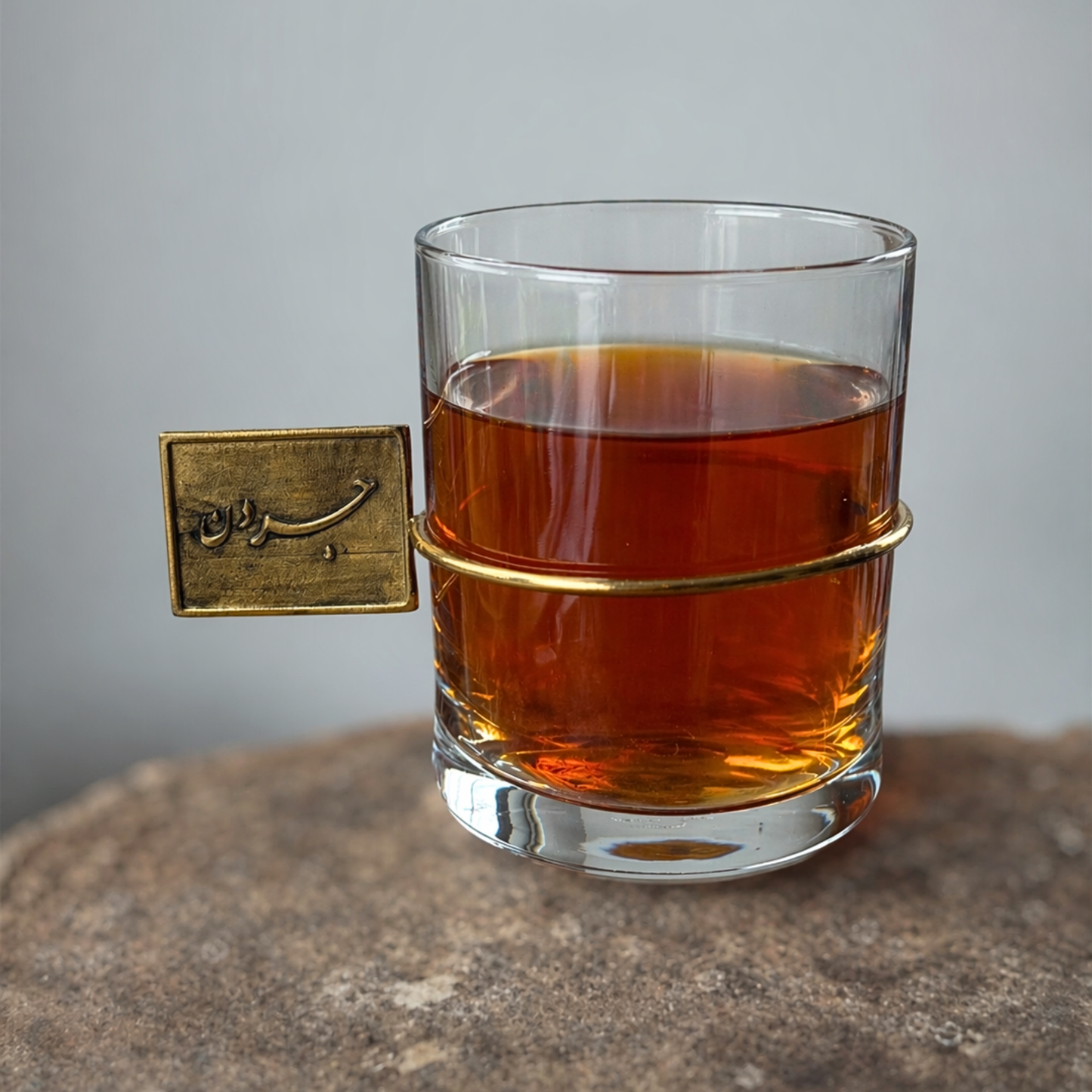 Modern clear tea glass gold handle Jordan Iran inspired design