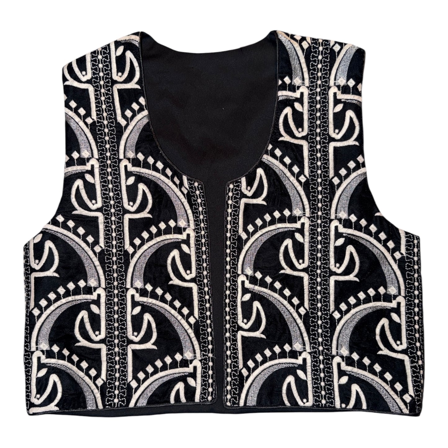 Black and ivory embroidered cropped vest featuring intricate geometric embroidery and artisan-inspired detailing.