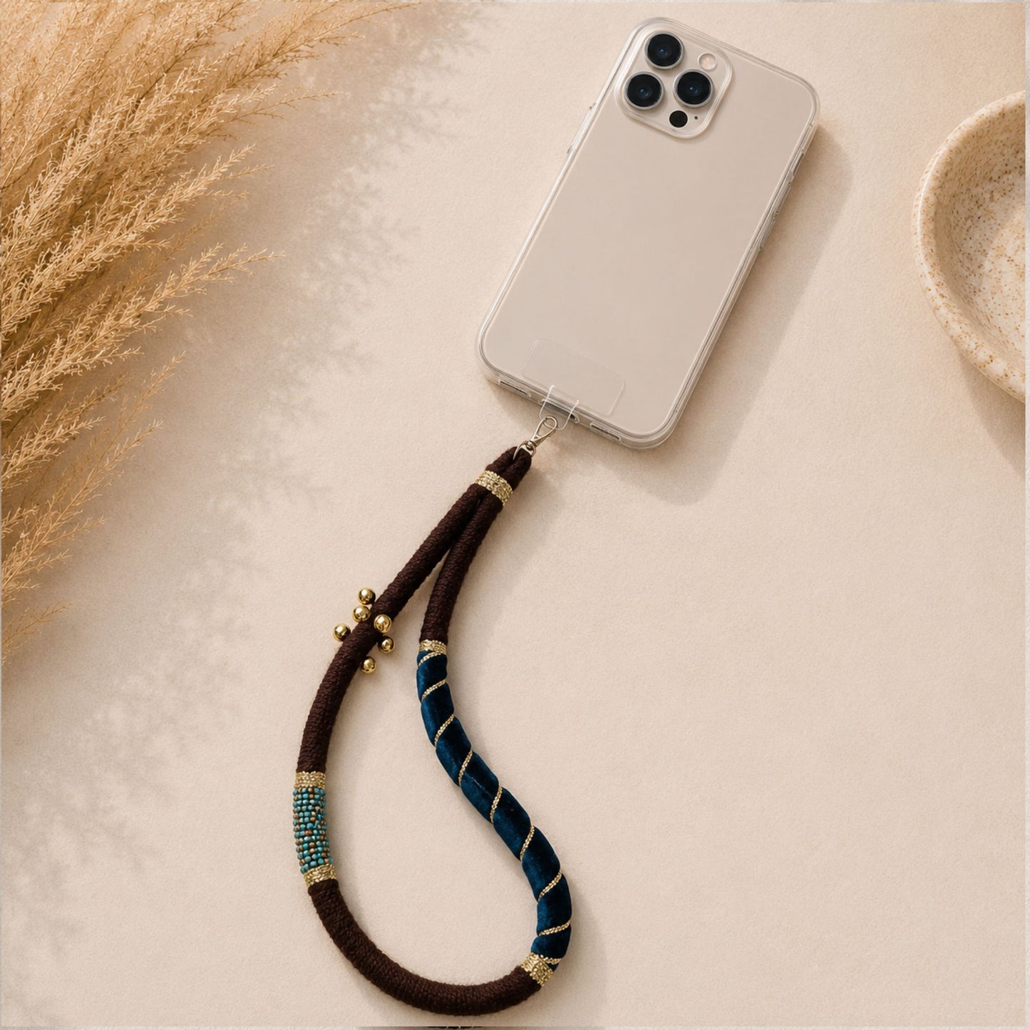 Brown and Emerald Green color handmade fabric phone lanyard with gold bell accents and beaded details