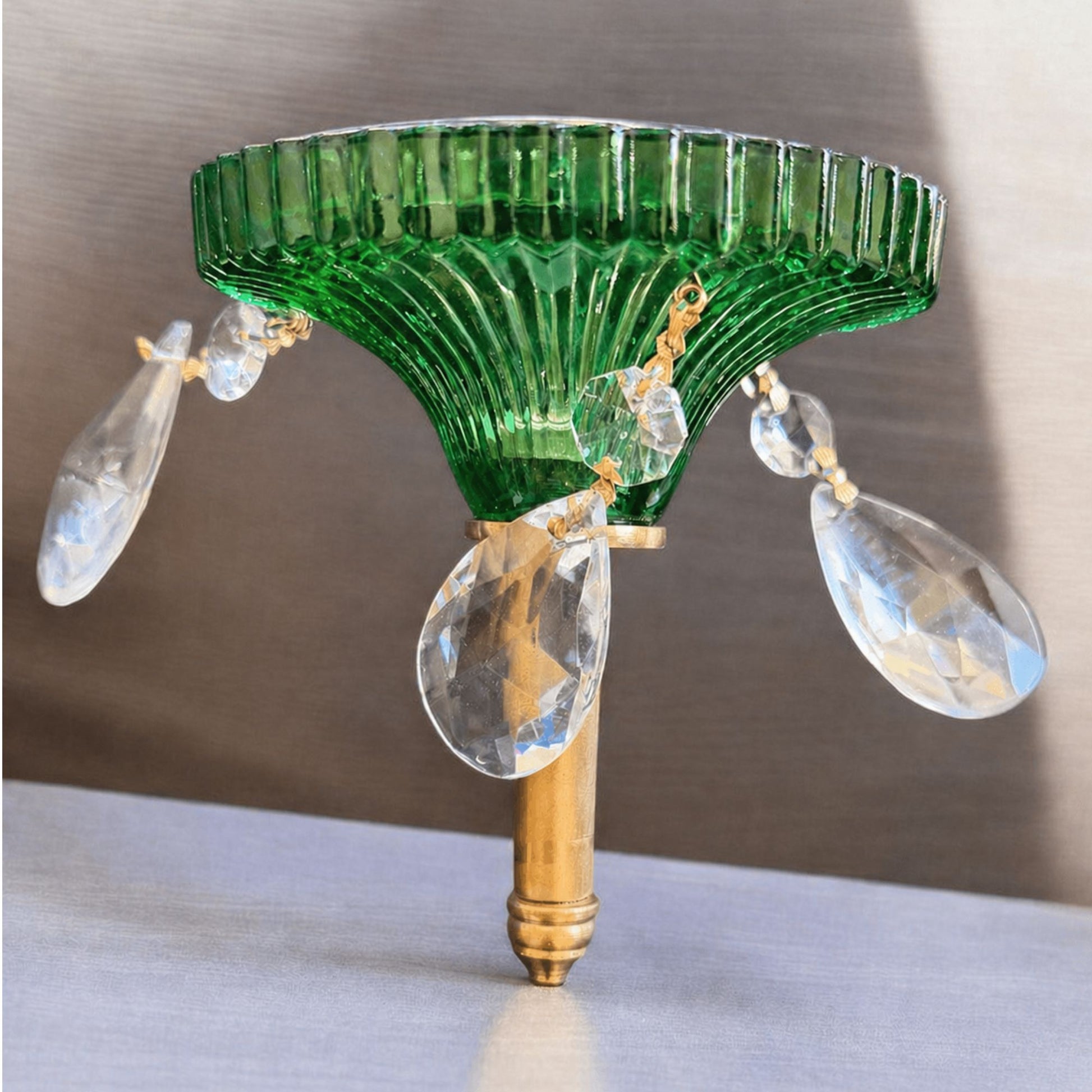 elegant green glass candle holder with gold base and crystals
