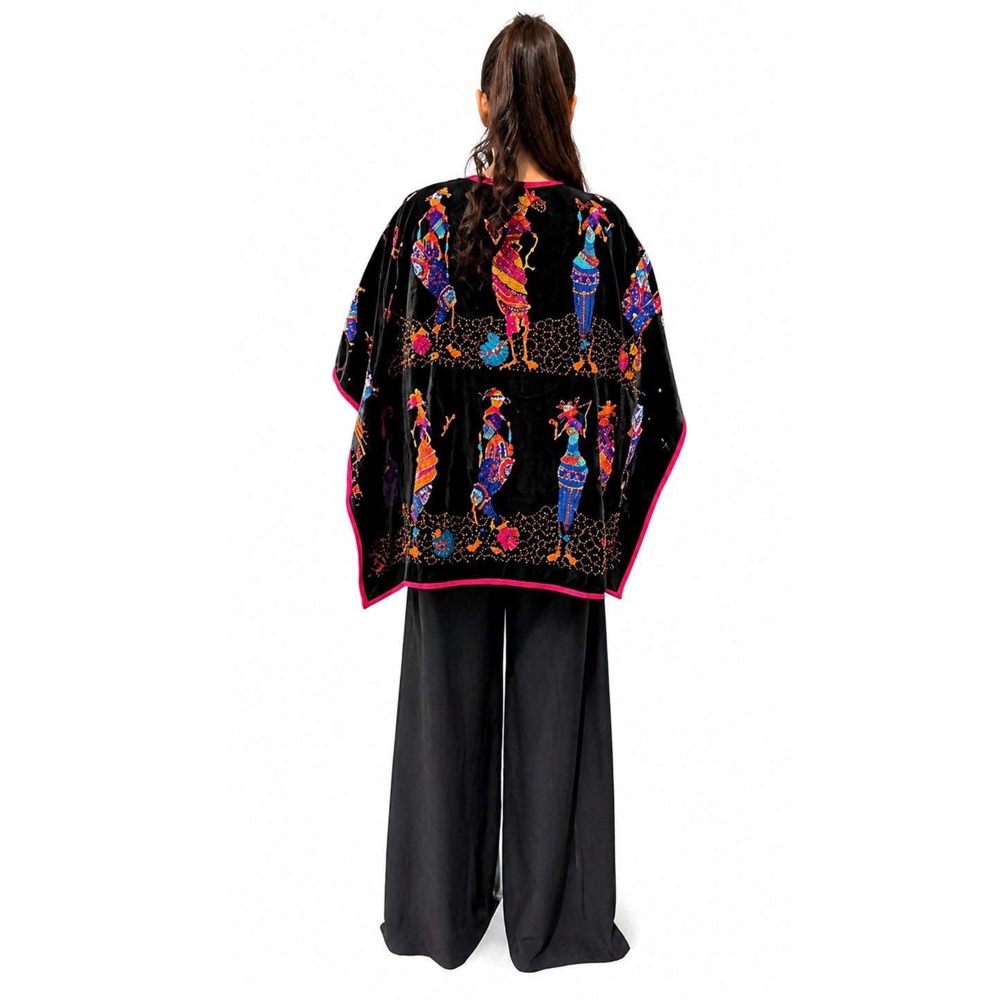 Back detail of embroidered velvet poncho showing intricate multicolor design