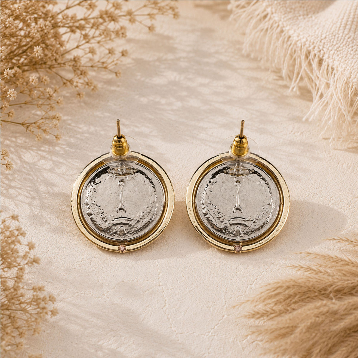 Back view of round gold-tone stud earrings, showing Persian-inspired coin and stud posts.