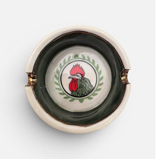 Close-up of rooster emblem on Khorosh Neshan Nostalgic Dish