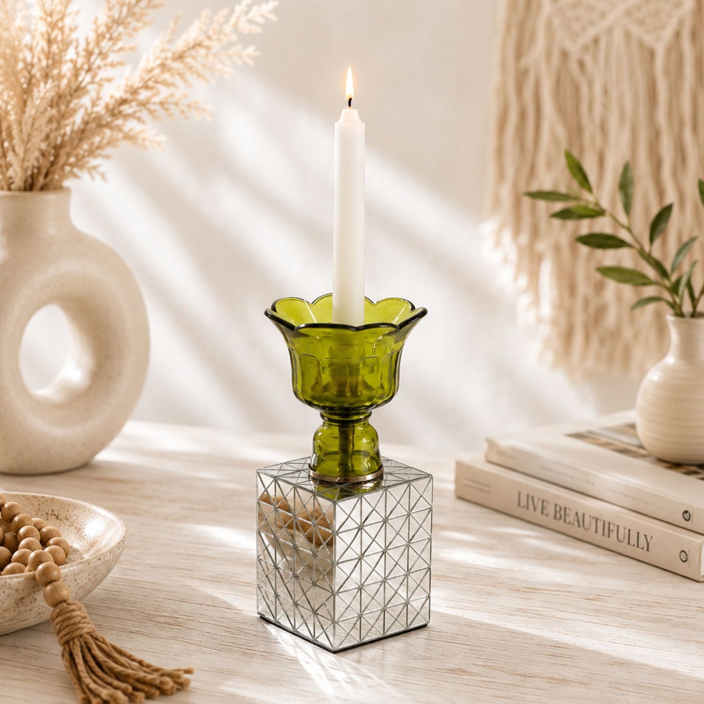 Handcrafted Light Olive Green glass candle holder with a mirrored mosaic cube base displayed in a modern boho-inspired interior.