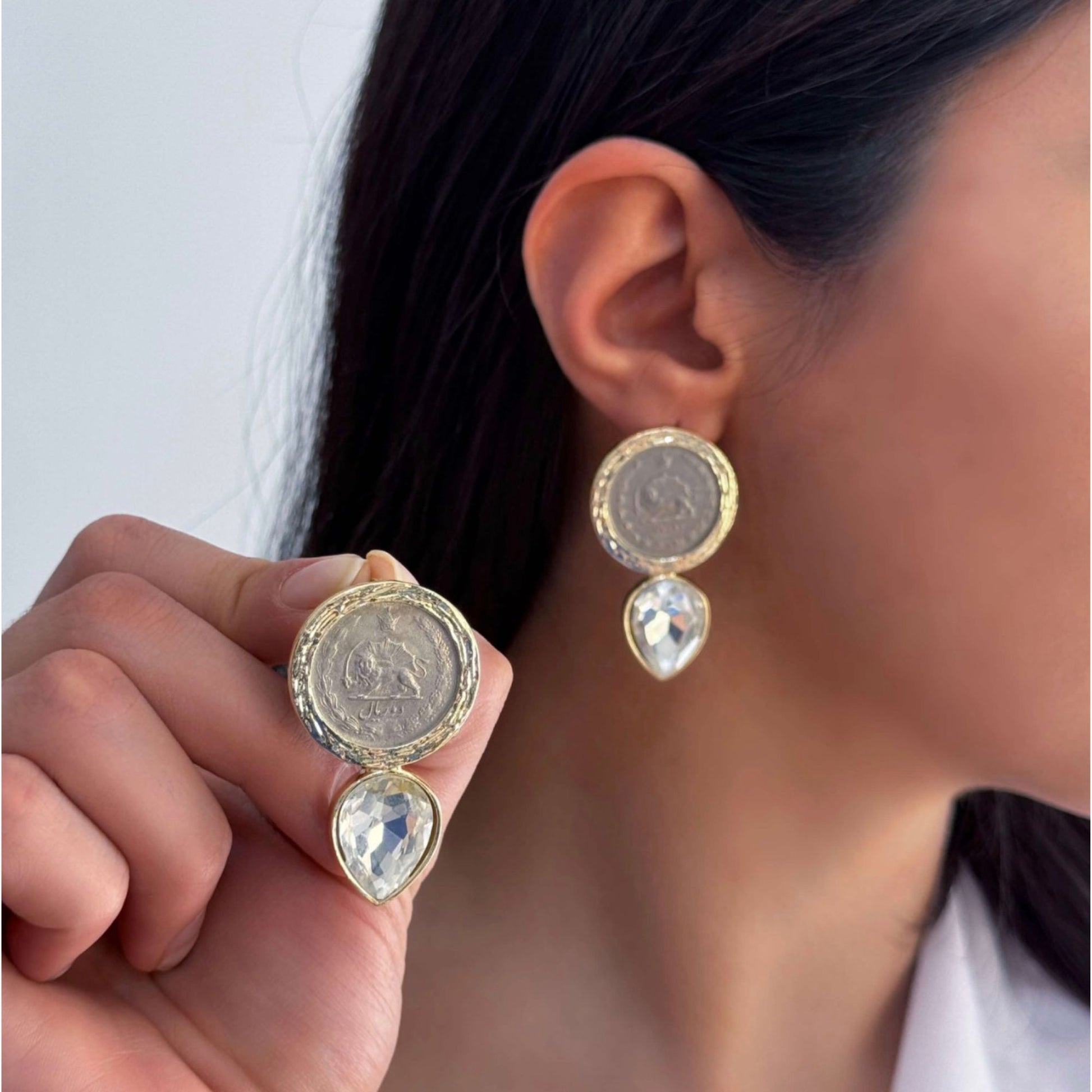Handmade gold Pahlavi coin earrings with crystal teardrop detail