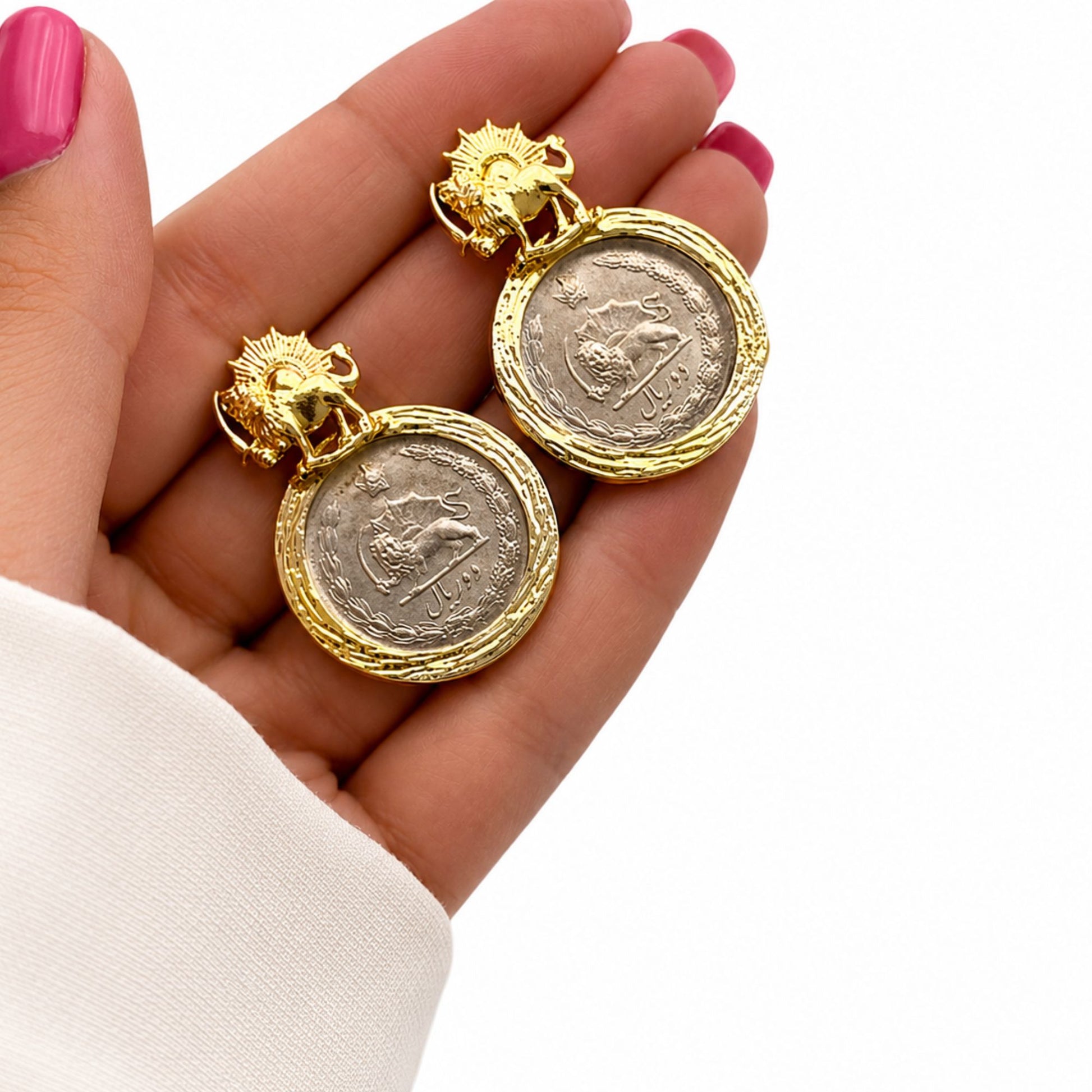 Close-up of Persian-inspired gold-plated coin earrings with vintage Pahlavi design