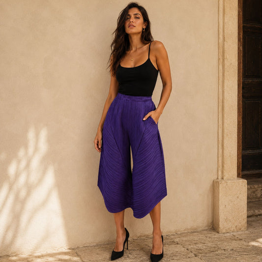 Women's purple pleated statement pants with flowing geometric shape and comfortable stretch waistband