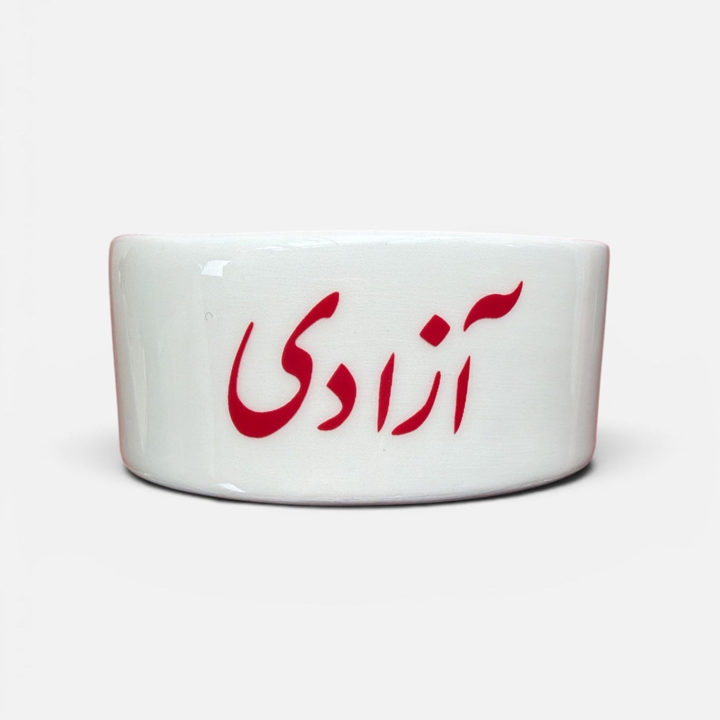 Azadi Persian dish with red interior and freedom script in Farsi
