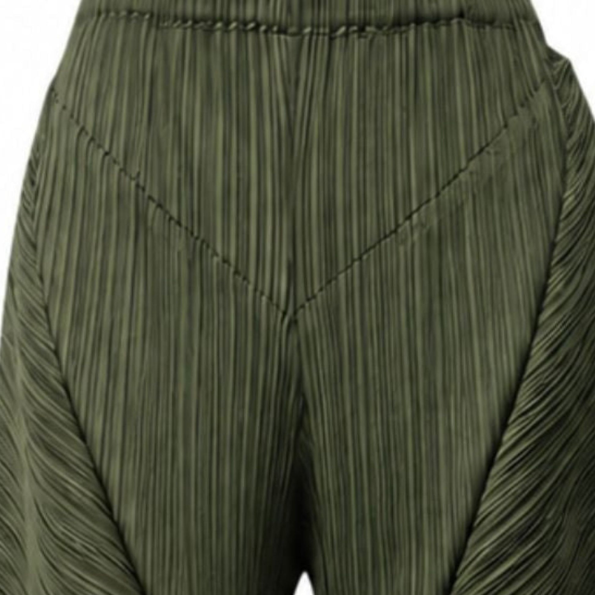 Close-up of green pleated pants
