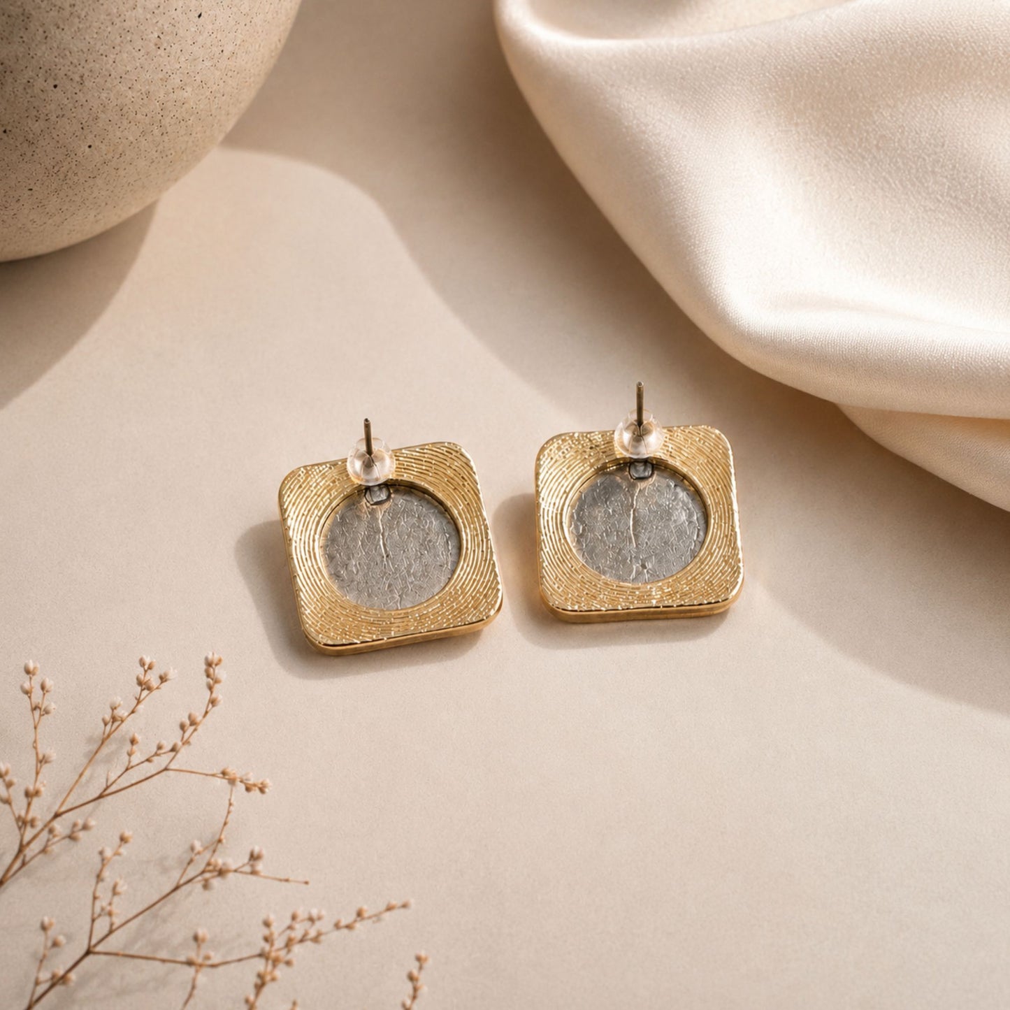 Backside of Persian-inspired statement stud earrings featuring vintage coin center