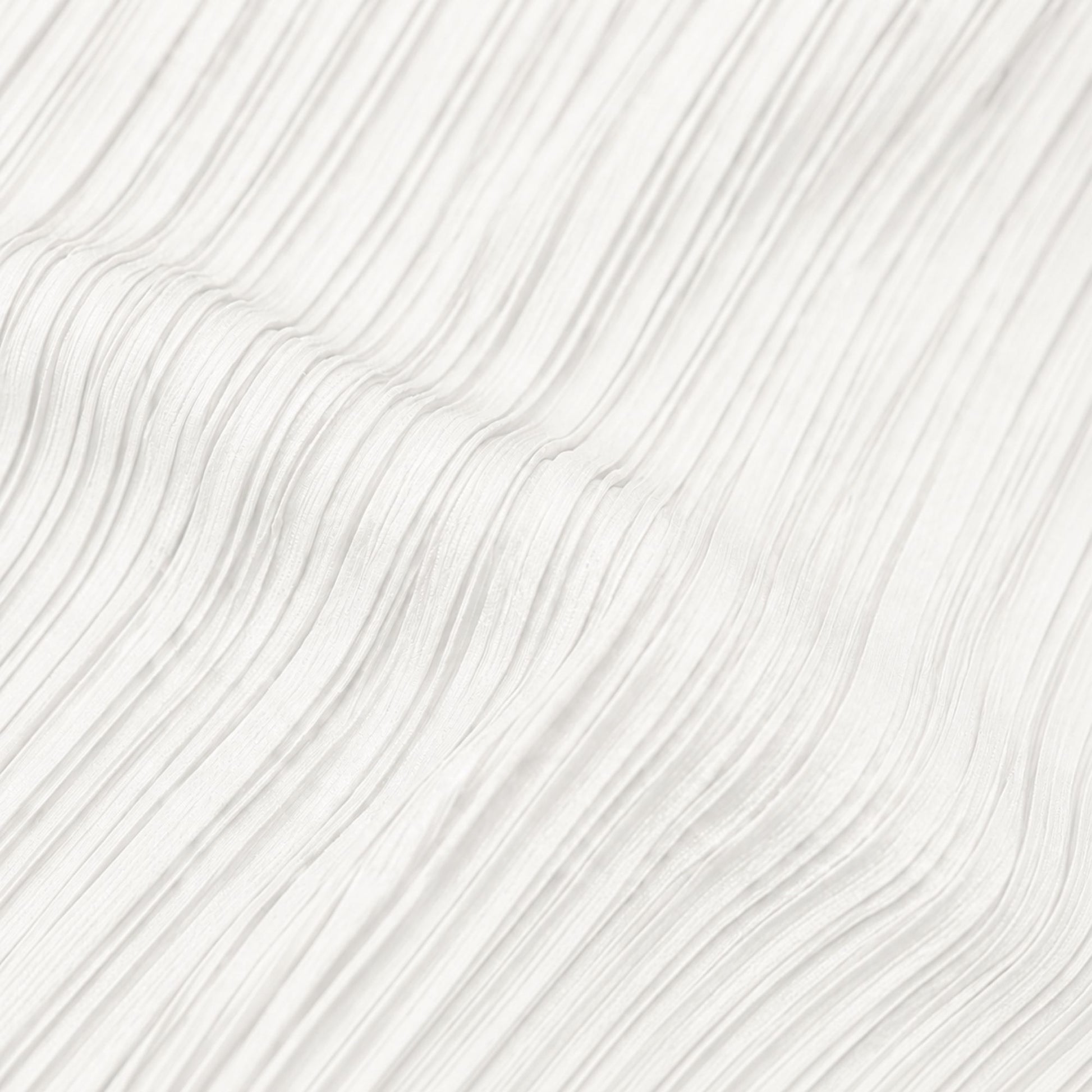 Close-up view of white pleated polyester fabric showing the textured lightweight material and fine pleat detail.